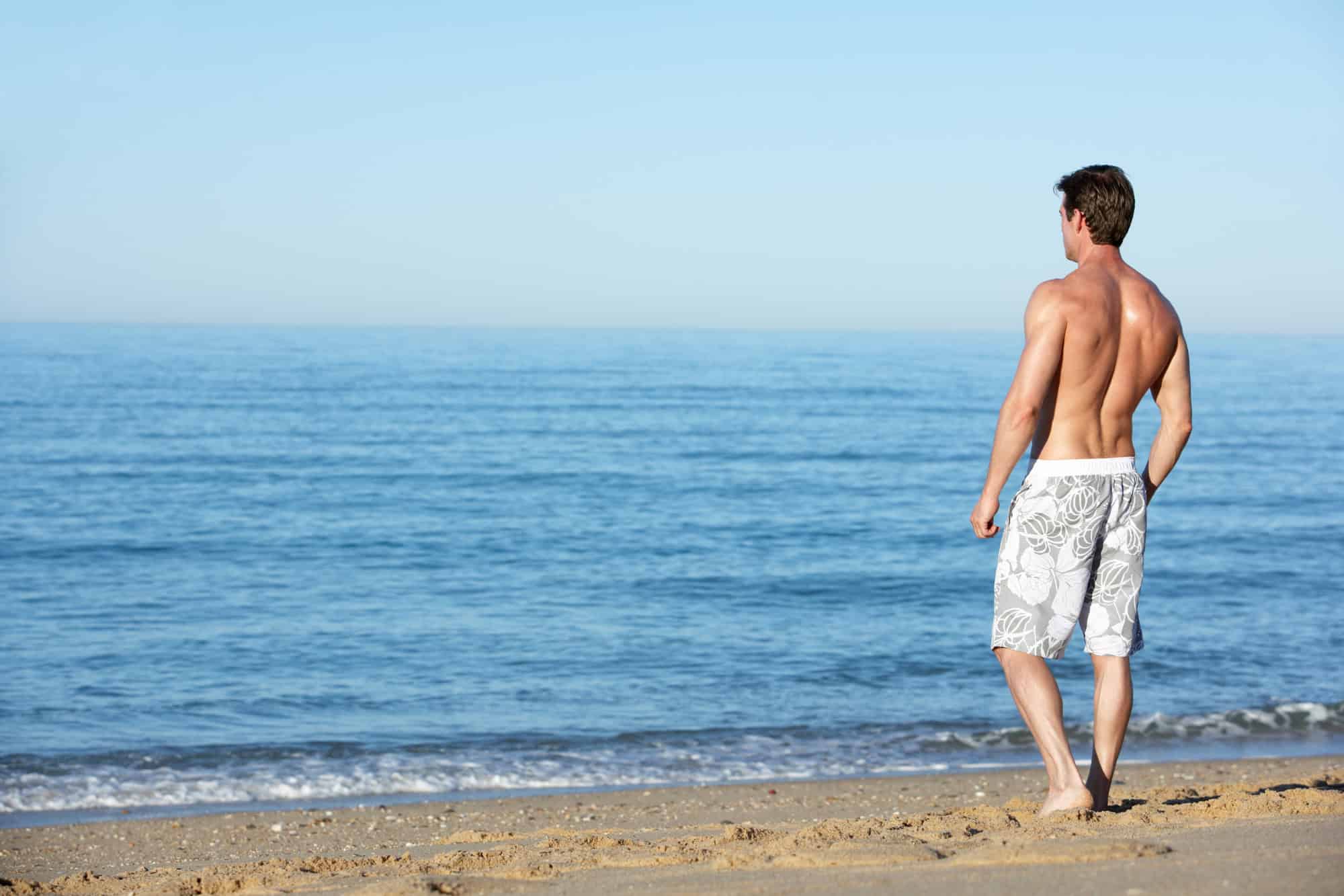 Master Packing for Paradise With These 15 Tips 5 Man Standing On Summer Beach