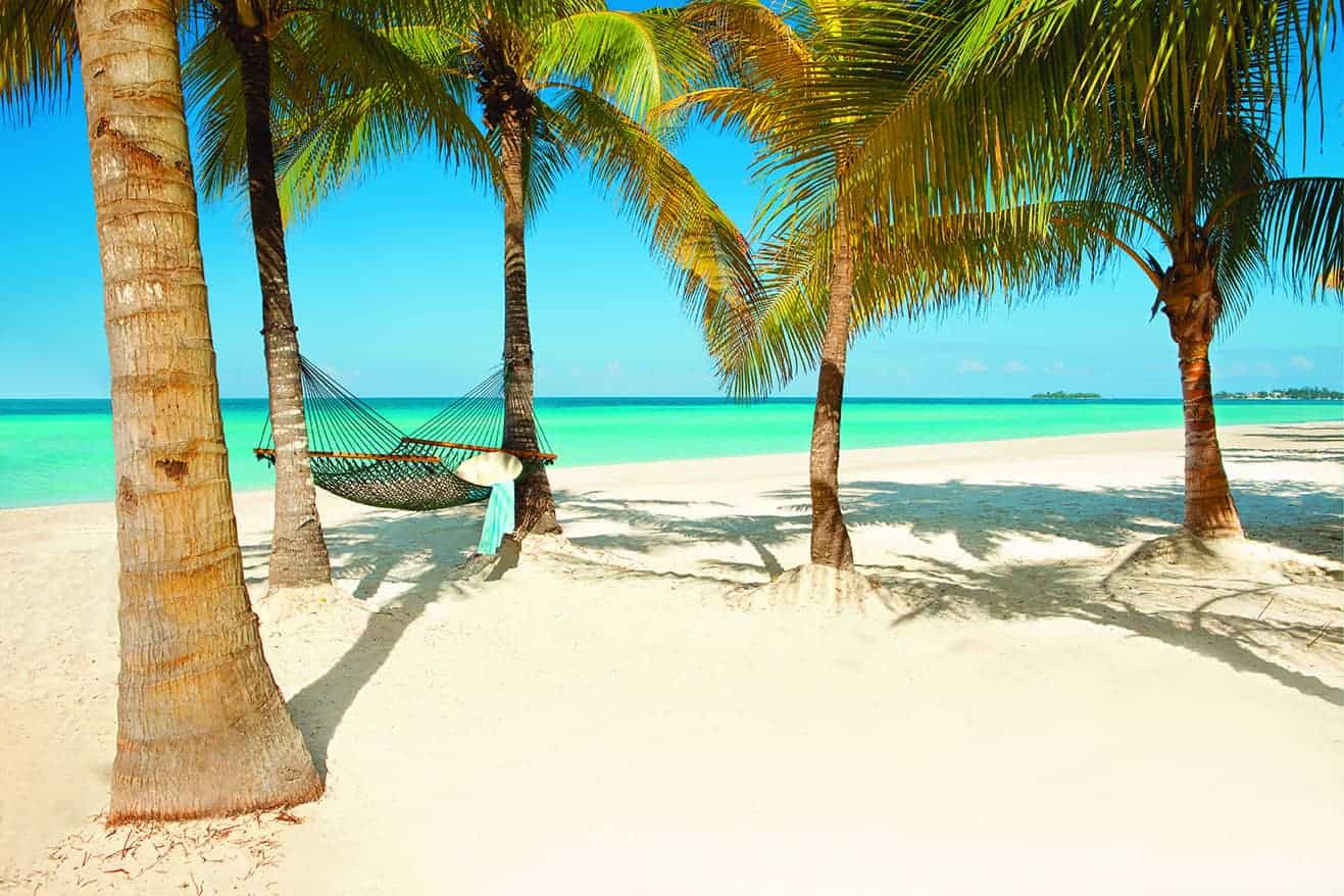 hammock on the beach in Couples Swept Away with crystal turquoise water in the background