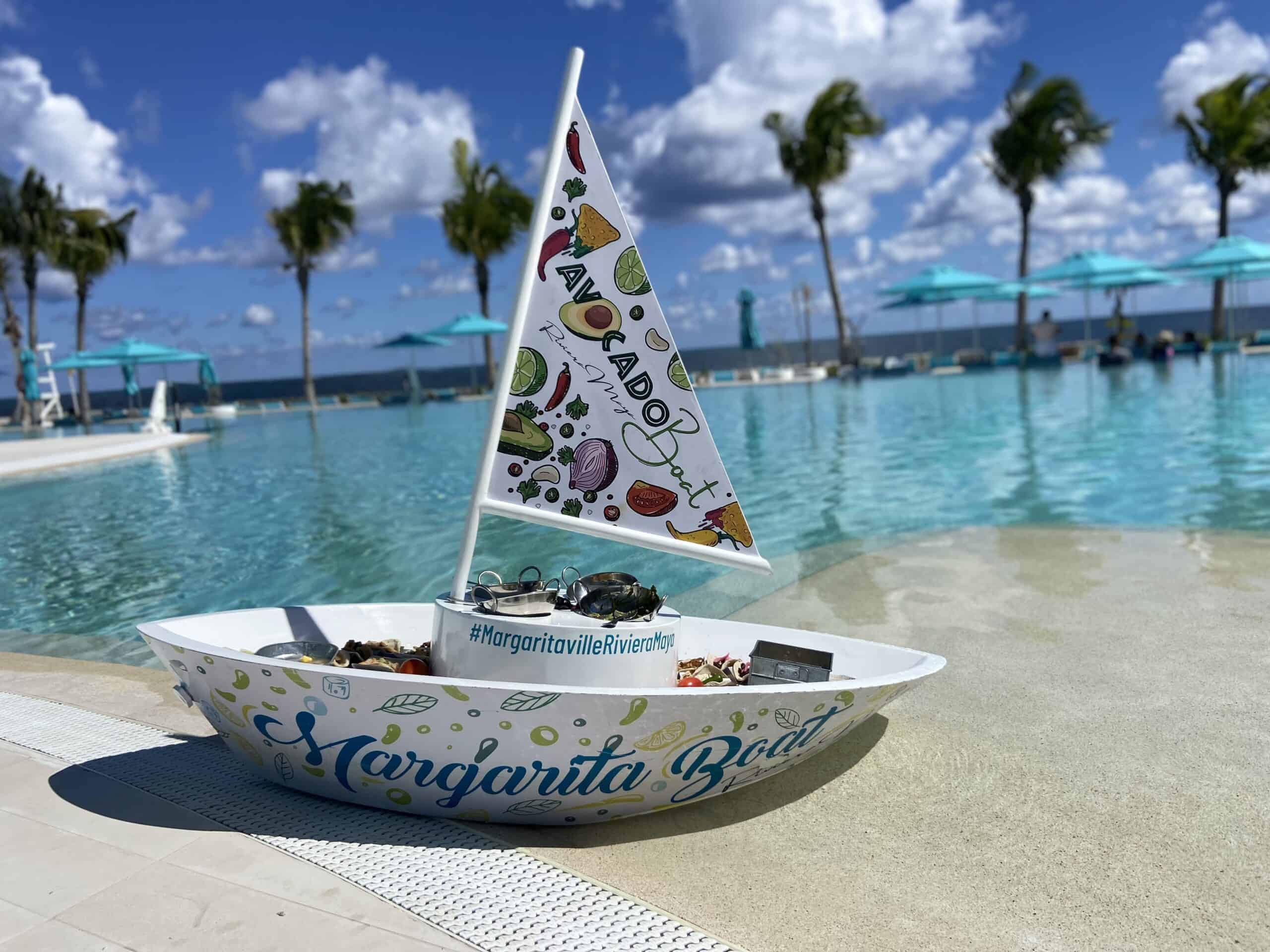 A small sailboat sits by the pool at Margaritaville Island Reserve