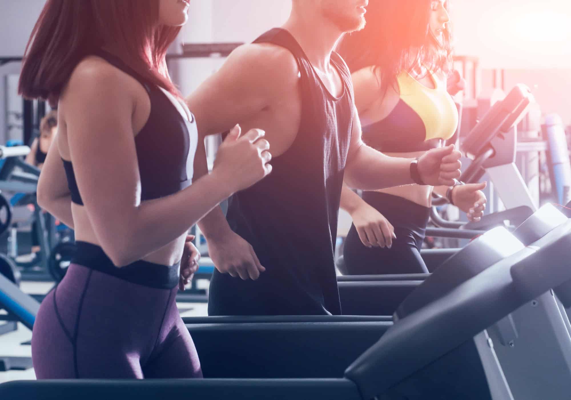 Here’s How Much Money People Spend on Spa Services at All-Inclusive Resorts 6 Young peoples training on treadmill at the gym. In fitness center. Health concept