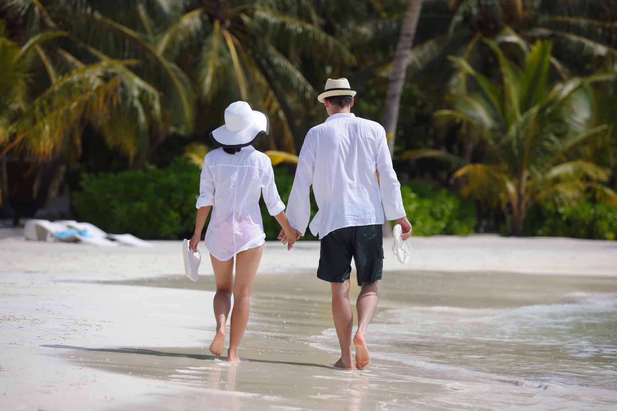 Happy young couple have fun on beach