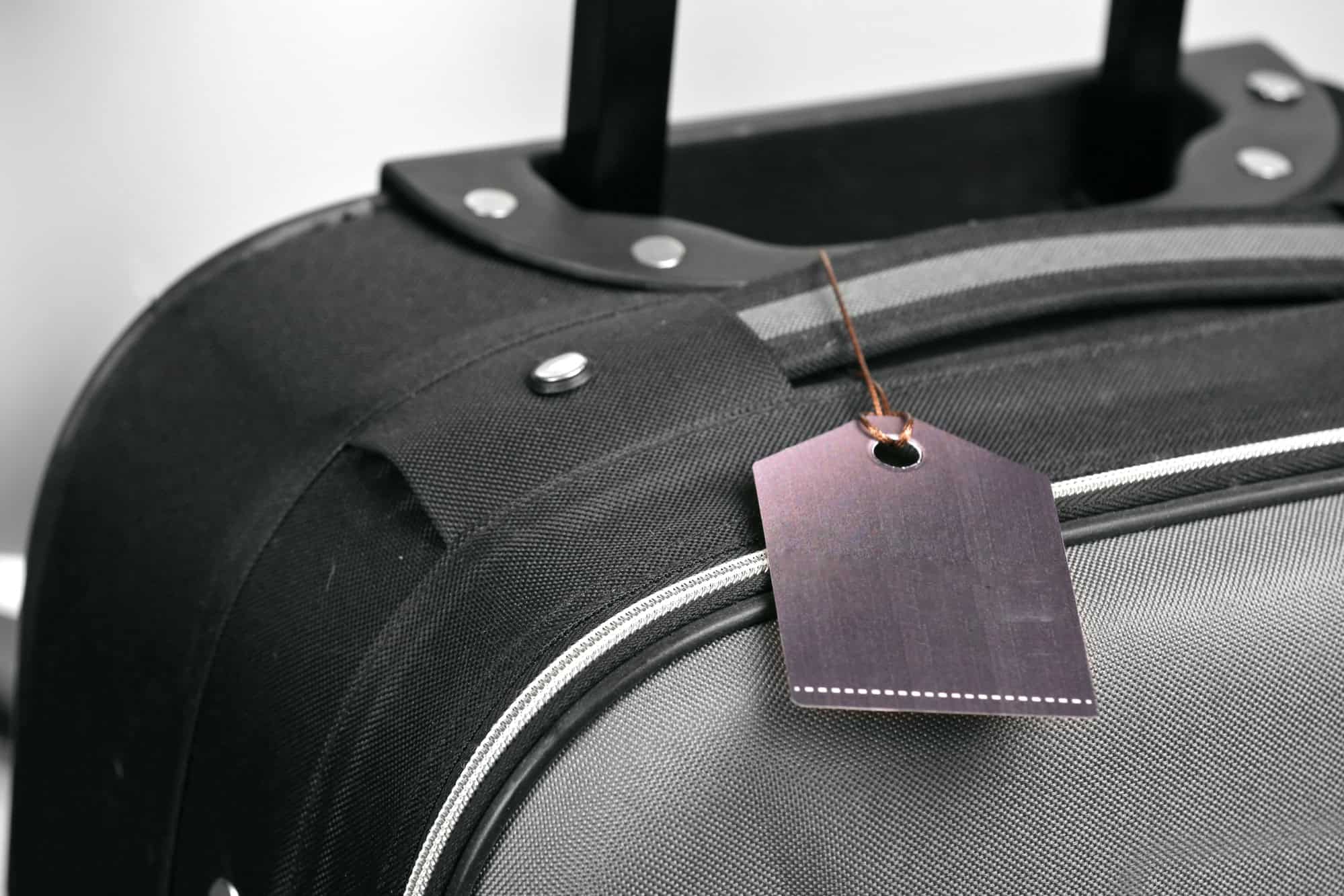 The Genius Trick to Keep Your Luggage From Getting Lost at the Resort 1 Suitcase with label