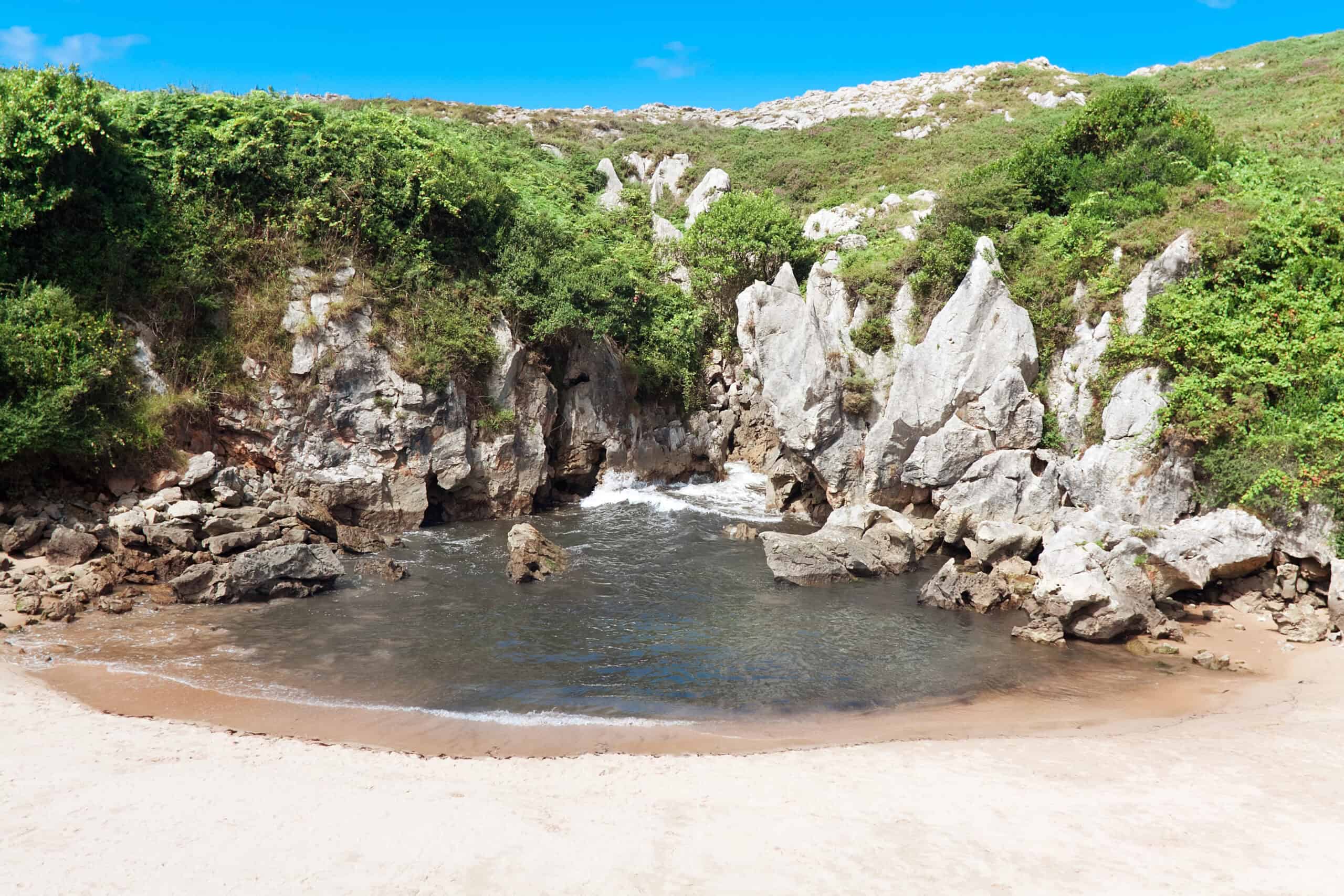 20 Hidden Beaches With the Bluest Waters You Won’t Believe Exist 20 Gulpiyuri Beach, Asturias, Spain