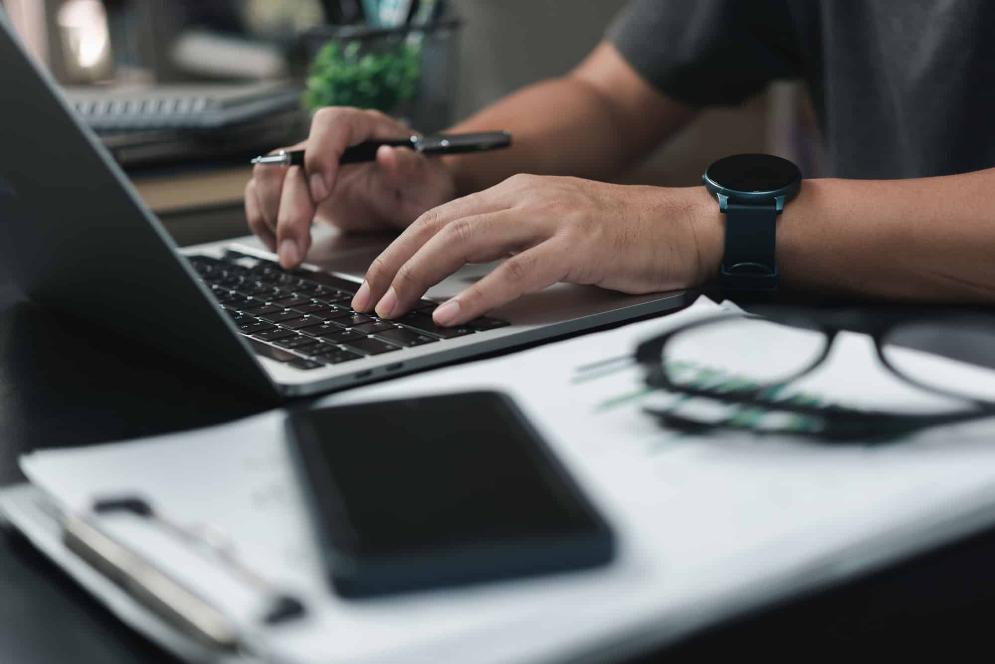 Man using laptop at his workplace