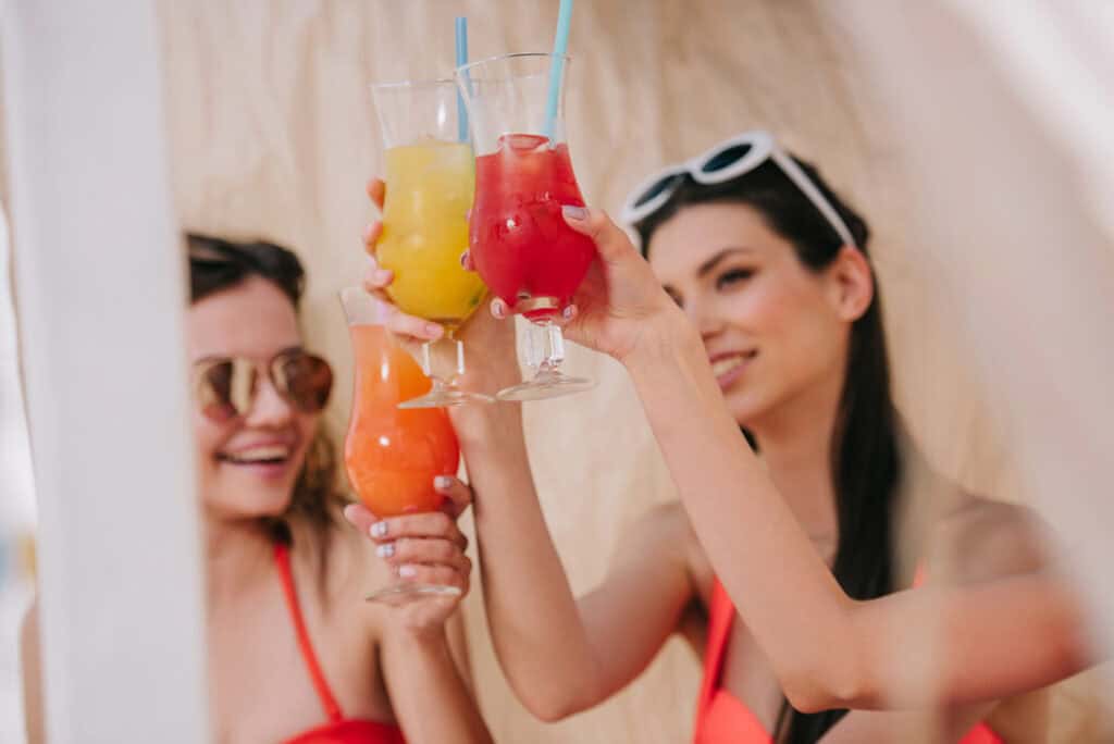 Florida's Best-Kept Secret: The Charming Shores of Pass-a-Grille Beach 2 Women clinking glasses